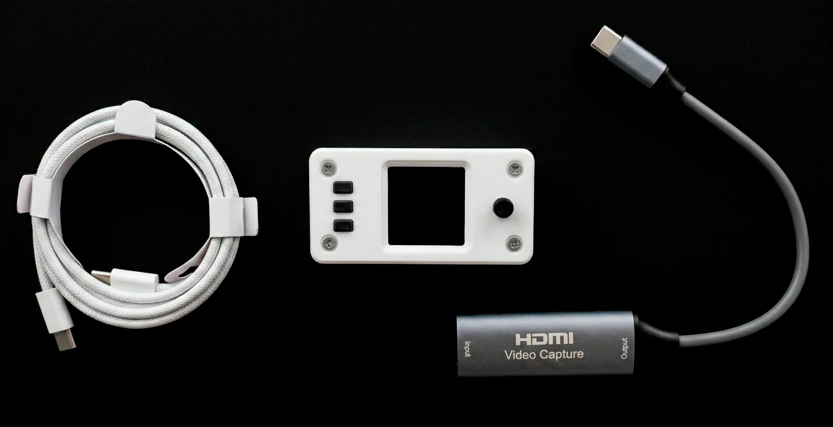 USBridge hardware KVM module alongside the included USB-C cable and HDMI video capture dongle