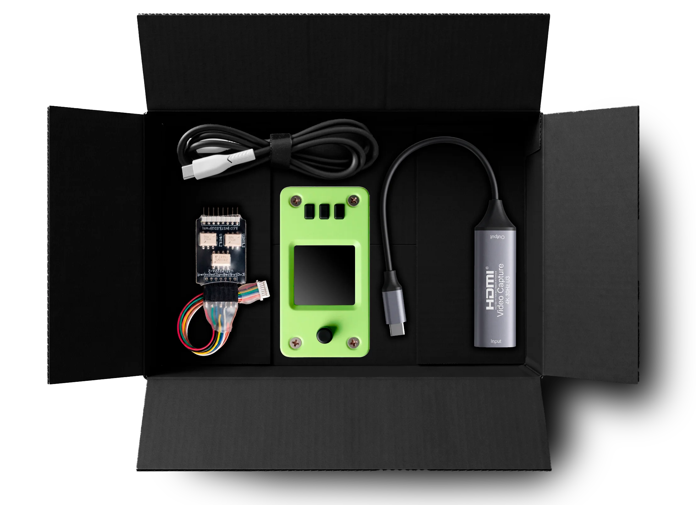 USBridge KVM over IP 2.0 full package contents: lime green KVM unit, HDMI video capture adapter, Power Management Module, and USB-C host cable in a professional black box.